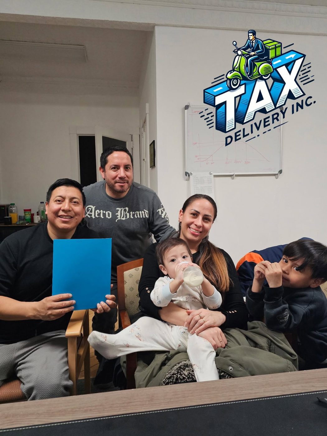 Joseph Delgado with clients at the Tax Delivery office